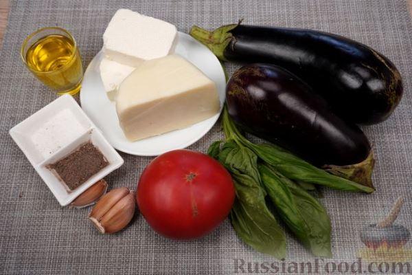 Битые баклажаны, фаршированные сыром, брынзой и помидорами (в духовке)